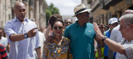Beyonce sports a braided updo and cultural attireas she and hubby Jay-Z celebrate their fifth anniversary in Cuba!