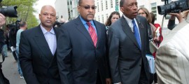 Brooklyn State Senator John Sampson (center) and his attorney Zachary Carter (right) leave Brooklyn Federal Court on Monday