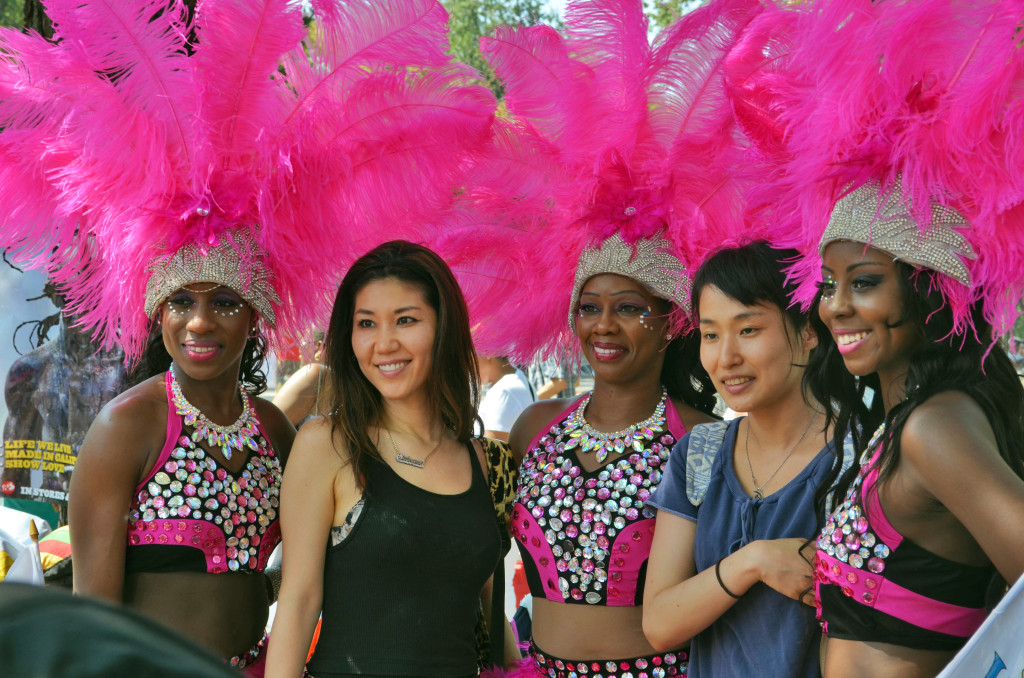 Virgin Islands Carnival Dancers meet festival-goers along the parade route.